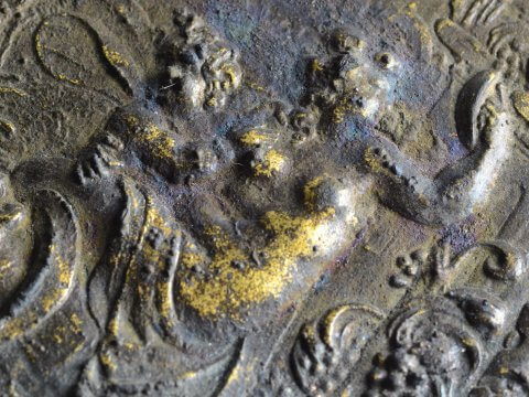 Poederdoos uit het Palmhoutwrak (detail Cupido) (c) Provincie Noord-Holland (geen publiek domein)
